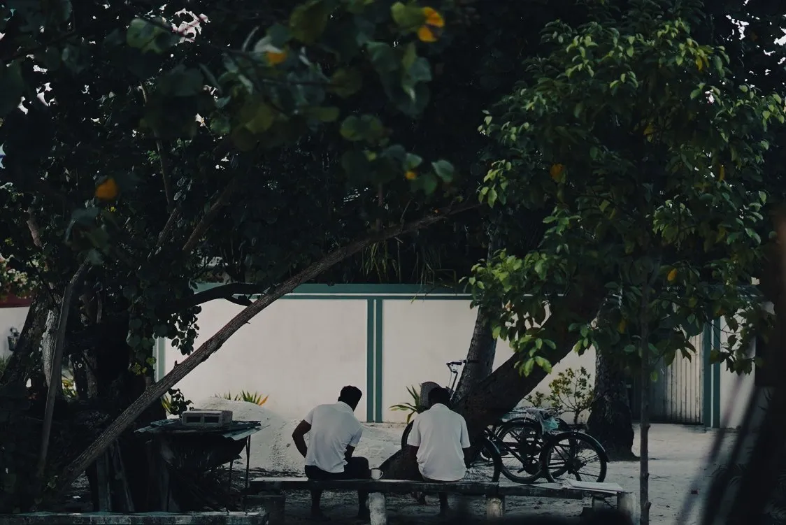 Workers conversing in the Maldives.